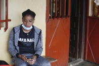 Guinean wrestler Fatoumata Yarie Camara waits to know of she will go or not to the Tokyo Olympics at her house in Conakry, Guinea, Wednesday July 21, 2021. A West African wrestler's dream of competing in the Olympics has come down to a plane ticket. Fatoumata Yarie Camara is the only Guinean athlete to qualify for these Games. She was ready for Tokyo, but confusion over travel reigned for weeks. The 25-year-old and her family can't afford it. Guinean officials promised a ticket, but at the last minute announced a withdrawal from the Olympics over COVID-19 concerns. Under international pressure, Guinea reversed its decision. (AP Photo/Youssouf Bah)