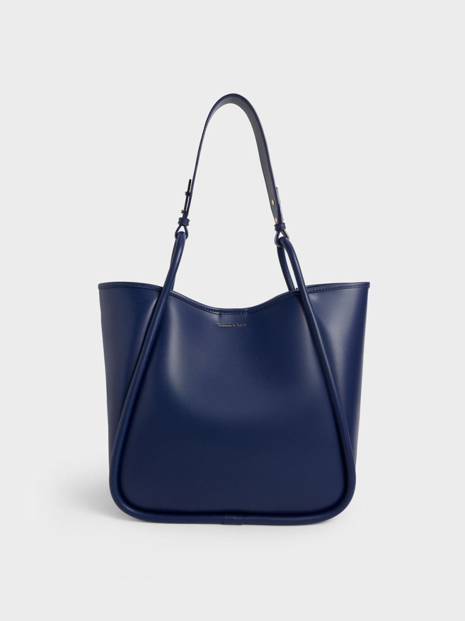 <p><a href="https://go.redirectingat.com?id=74968X1596630&url=https%3A%2F%2Fwww.charleskeith.com%2Fus%2Fbags%2FCK2-30781867-1_NAVY.html&sref=https%3A%2F%2Fwww.harpersbazaar.com%2Ffashion%2Ftrends%2Fg43944868%2Fbest-oversized-tote-bags%2F" rel="nofollow noopener" target="_blank" data-ylk="slk:Shop Now;elm:context_link;itc:0;sec:content-canvas" class="link ">Shop Now</a></p><p>Tubular Slouchy Tote Bag</p><p>$93.00</p><p>charleskeith.com</p>