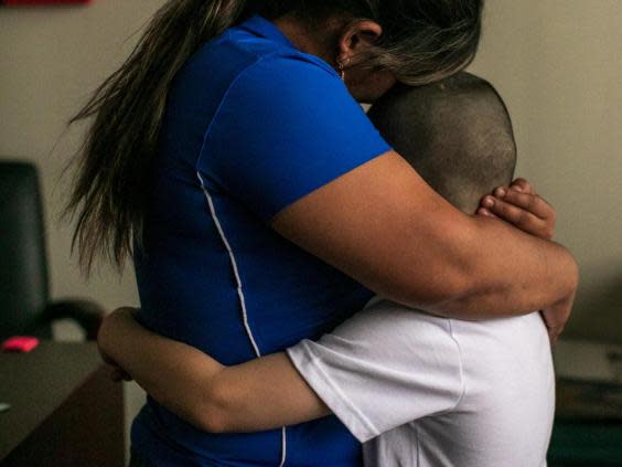 Patricia and her son, Jose, 8, from Honduras, in their lawyer's office in Bryan, Texas (NYT)