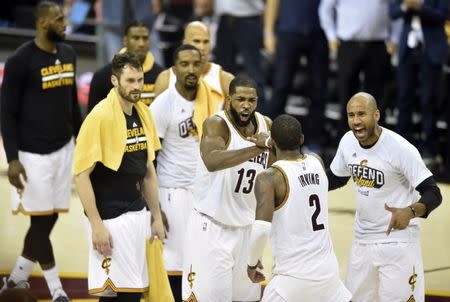 May 23, 2017; Cleveland, OH, USA; Cleveland Cavaliers guard Kyrie Irving (2) is congratulated by his teammates after making a three-point goal at the end of the third quarter against the Boston Celtics in game four of the Eastern conference finals of the NBA Playoffs at Quicken Loans Arena. Mandatory Credit: David Richard-USA TODAY Sports