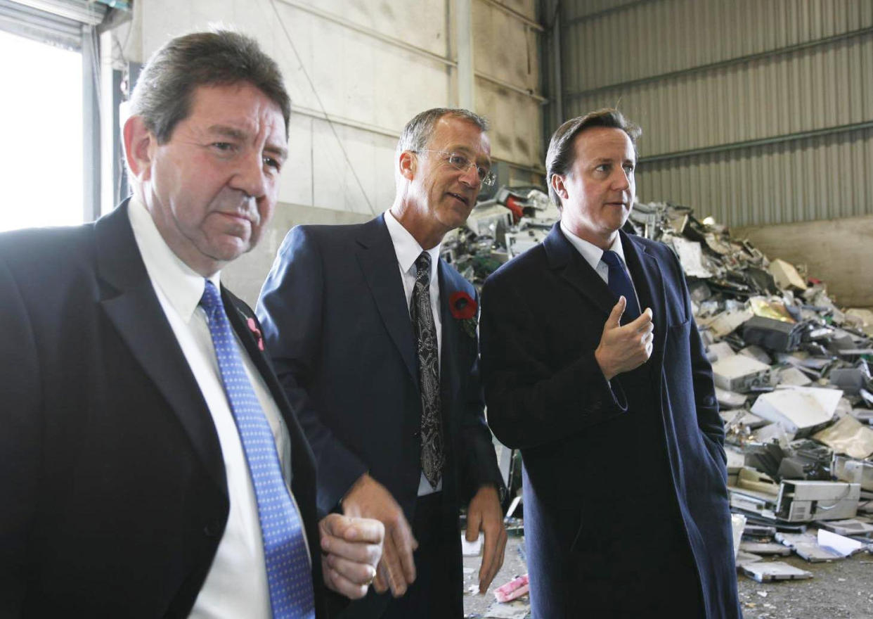 Conservative Party leader David Cameron speaks to Managing Director Patrick Watts (centre) and Gordon Henderson, Parliamentary spokesman for Sittingbourne (left), during a visit to SWEEEP Ltd, Gas Road, Sittingbourne, Kent.