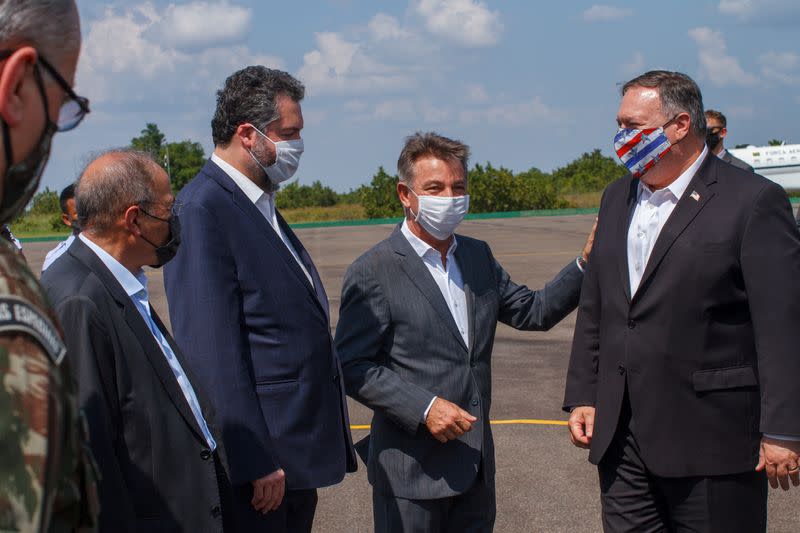 Roraima governor Antonio Denarium and Brazil's Foreign Minister Ernesto Araujo welcome U.S. Secretary of State Mike Pompeo in Boa Vista, Roraima state