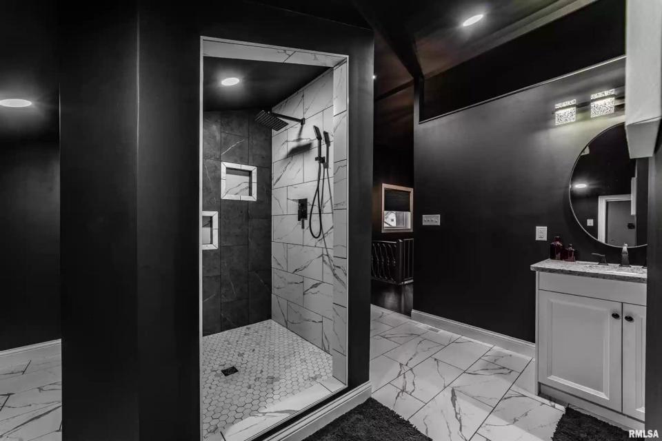 A black and marble bathroom in the "goth" house.