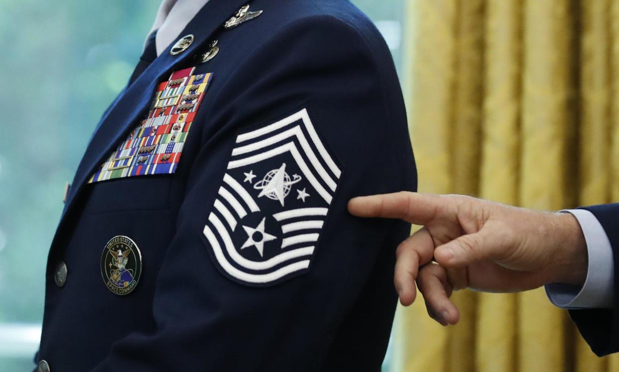 <span>Chief Master Sgt Roger Towberman displays his insignia during a presentation of the US space force flag in the Oval Office in May 2020. </span><span>Photograph: Alex Brandon/AP</span>