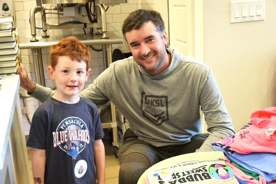 Bubba Watson with young fan during grand reopening of Bubba's Sweet Spot on Sept. 10