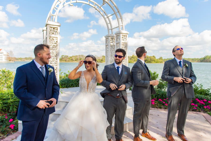 Bride Kristin Robinson, who is colorblind, sees the world in color for the first time as she celebrates her dream wedding alongside her groom and family at Disney’s Wedding Pavilion on January 25, 2023 at Walt Disney World Resort in Lake Buena Vista, Fla. (Abigail Nilsson, photographer)