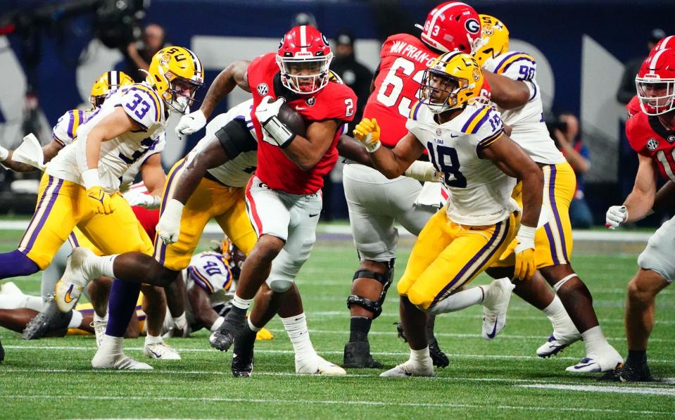 Georgia running back Kendall Milton carries the ball against LSU in the SEC championship.