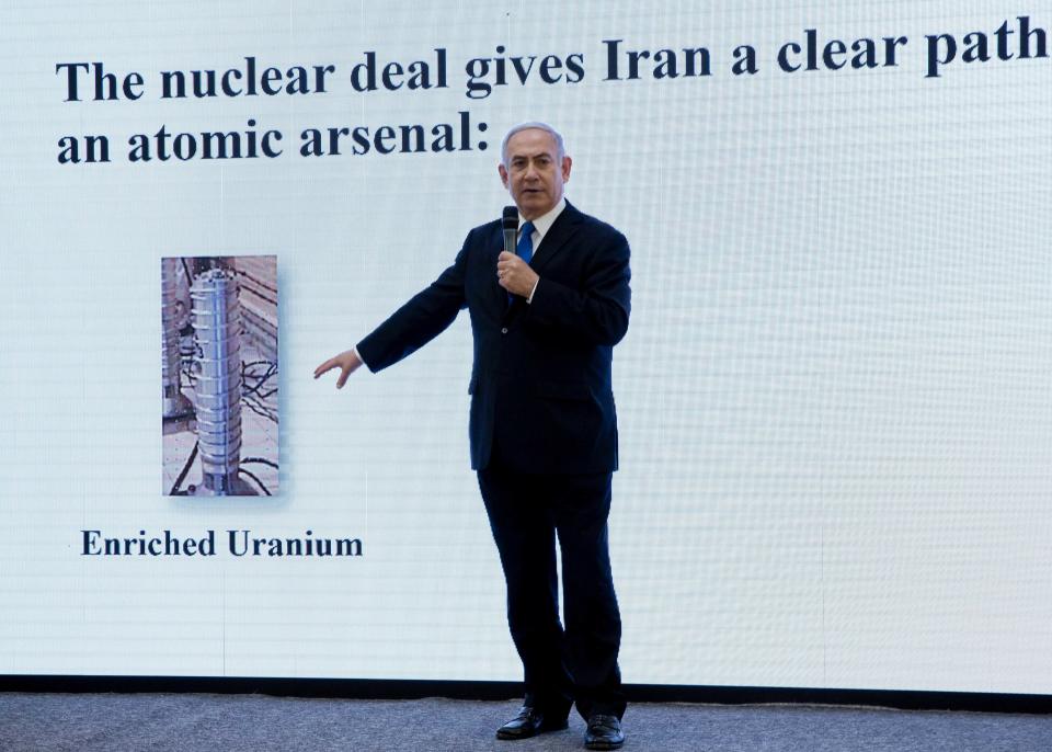 FILE - In this April 30 2018 file photo, Israeli Prime Minister Benjamin Netanyahu presents material on Iranian nuclear weapons development during a press conference in Tel Aviv. Netanyahu has been a vocal critic of Iran over the years, accusing the Islamic Republic of sinister intentions at every opportunity. But the outspoken Israel leader has remained uncharacteristically quiet throughout the current crisis between the U.S. and Iran. (AP Photo/Sebastian Scheiner, File)