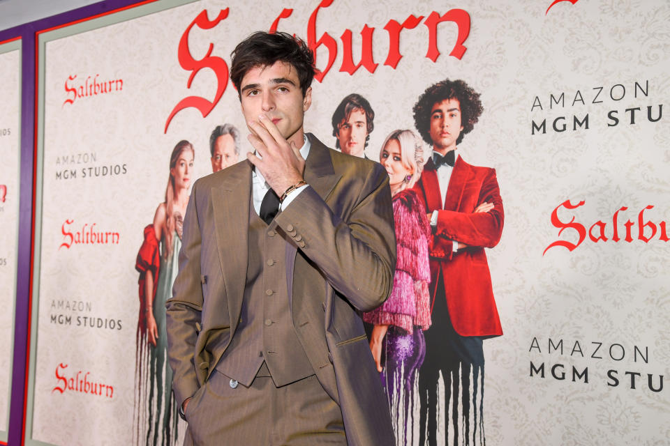 Jacob Elordi in front of the "Saltburn" promotional poster
