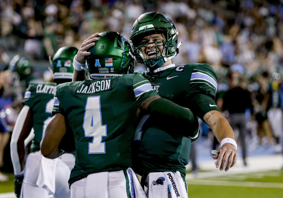 Tulane wide receiver Jha'Quan Jackson (4) and quarterback Michael Pratt (7) celebrate after a touchdown against South Alabama during the second half of an NCAA college football game in New Orleans, Saturday, Sept. 2, 2023. (AP Photo/Derick Hingle)