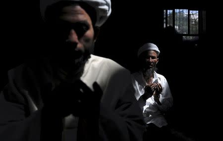 Muslims pray at a mosque in Aksu, Xinjiang Uighur Autonomous Region in this August 3, 2012 file photo. REUTERS/Stringer/Files