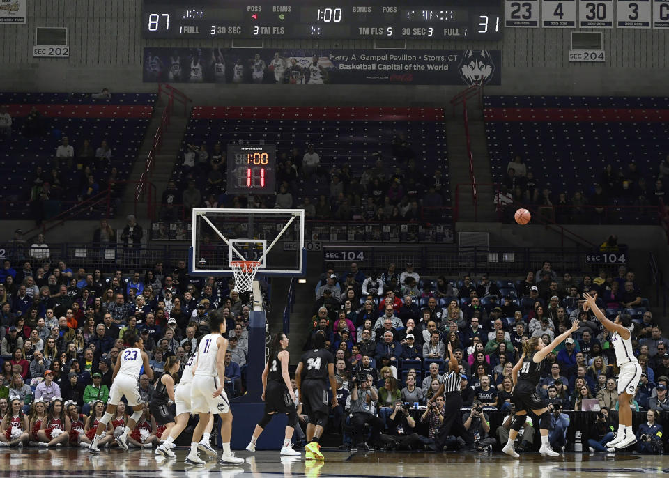 Connecticut’s Megan Walker (3), right, hits a 3-point basket with one minute left in the first half of play to bring UConn to 90 points against Saint Francis (Pa.) during a first-round game in the NCAA women’s college basketball tournament in in Storrs, Conn., Saturday, March 17, 2018. UConn has set the NCAA all-time record for points in a half with 94. (AP Photo/Jessica Hill)