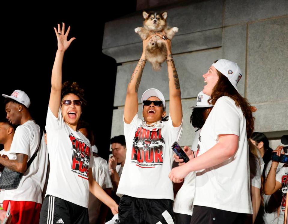N.C. State’s Aziaha James, center, along with River Baldwin, right, and Madison Hayes celebrate after a ceremony for the N.C. State men’s and women’s basketball team at the Memorial Belltower in Raleigh, N.C., Monday, April 15, 2024. Both teams made it to the NCAA Tournament Final Four, the first time both teams made it in the same year. Ethan Hyman/ehyman@newsobserver.com