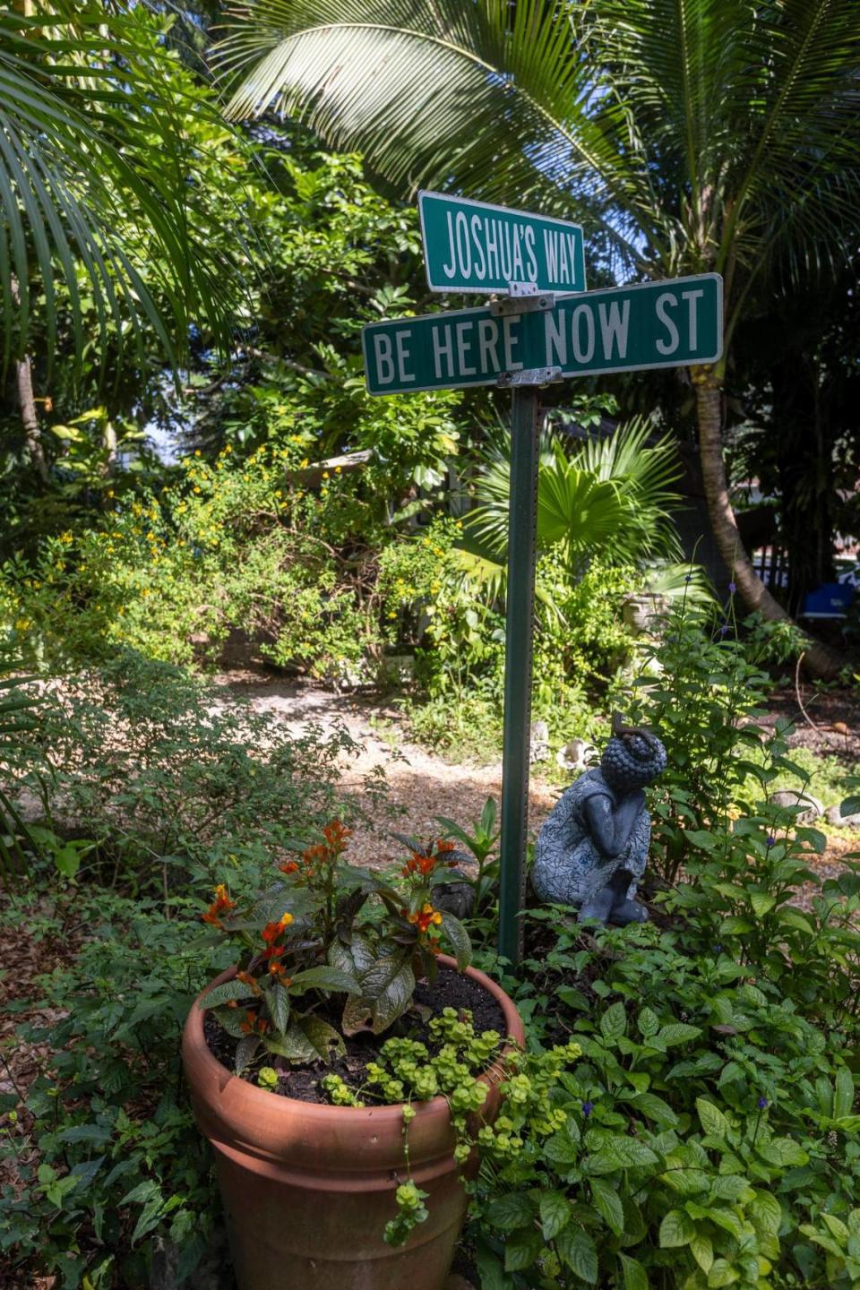 Street signs in the gardens of Shawnee Chasser’s property in unincorporated Miami-Dade near North Miami on Friday, Sept. 8, 2023.