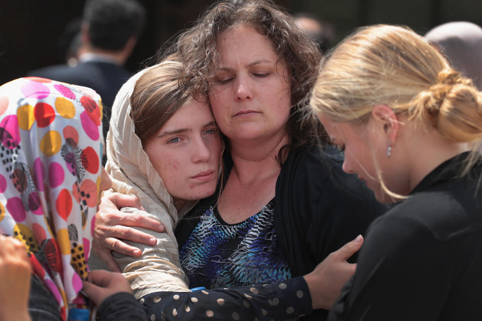 Sabika Sheikh's host family members are comforted following a funeral prayer service at the Brand Lane Islamic Center on May 20, 2018 in Stafford, Texas. (Photo: Scott Olson via Getty Images)