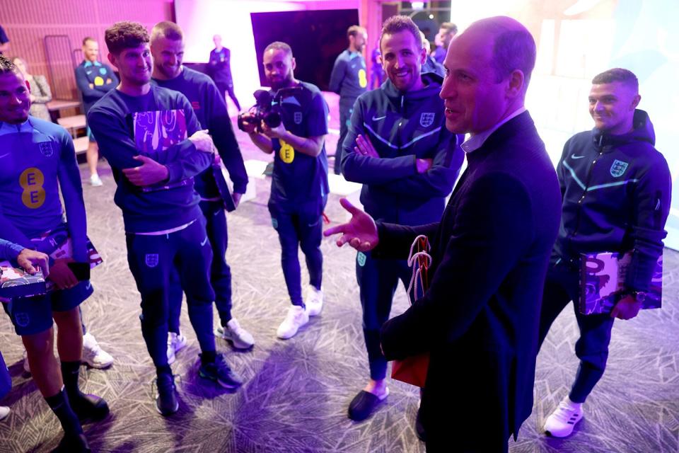 Prince William, Prince of Wales talks to players of England at St George's Park