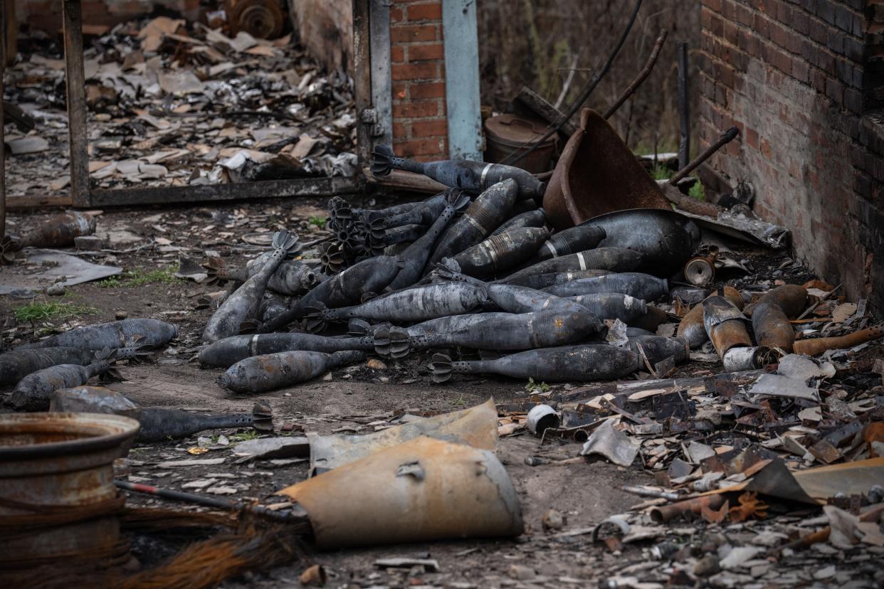 Soviet-era 120 millimetre mortars lie on the ground after being charred during fighting between Ukrainian and Russian occupying forces, on October 23, 2022 in Kam'yanka, Kharkiv oblast, Ukraine.