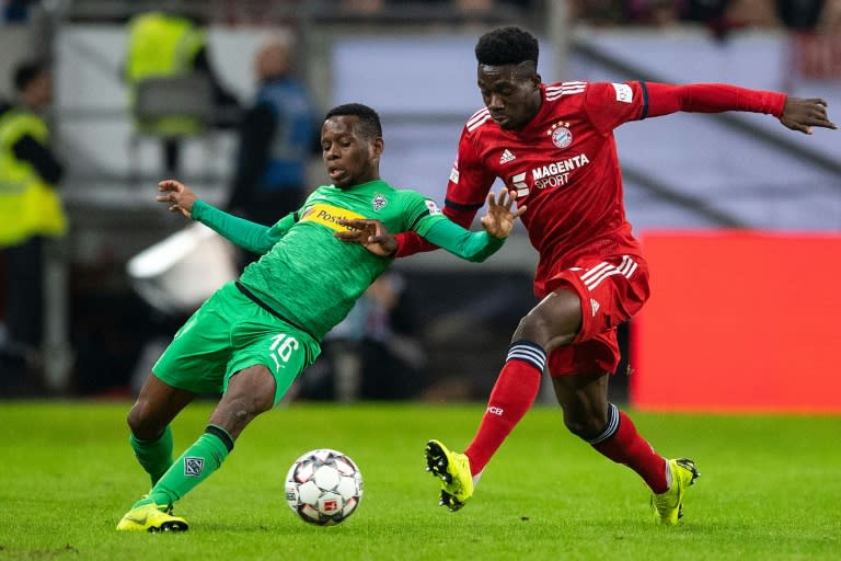 Canadian midfielder Alphonso Davies (R) could make his Bundesliga debut on Friday night after his first appearance for Bayern Munich in Sunday's victory over Borussia Moenchengladbach in the final of a four-team mini tournament in Duesseldorf