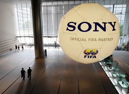 A large soccer ball-shaped installation promoting Sony Corp's partnership with FIFA is hung at Sony Corp's headquarters in Tokyo June 19, 2009. REUTERS/Kim Kyung-Hoon