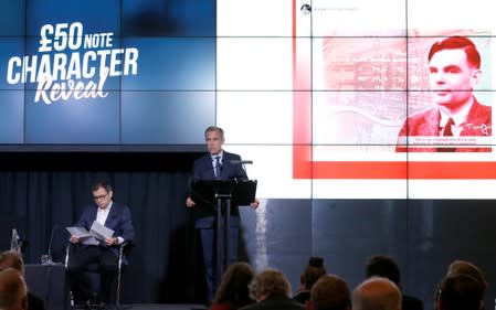 Bank of England governor Mark Carney presents the image of mathematician Alan Turing who will appear on a new 50 pound note at the Science and Industry Museum in Manchester