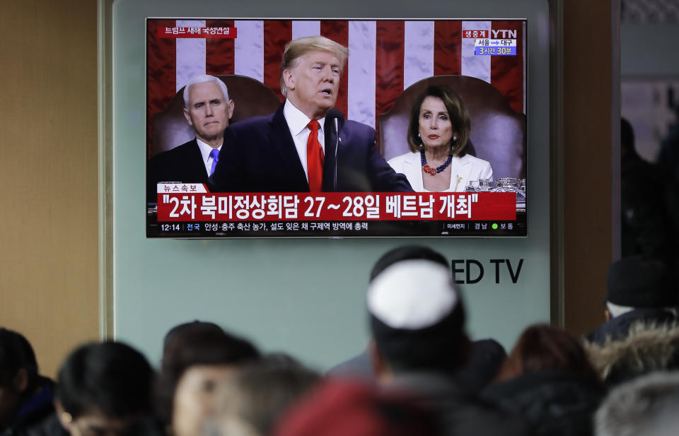 In this Feb. 6, 2019 photo, People watch a TV screen showing a live broadcast of U.S. President Donald Trump delivering his State of the Union address at the Seoul Railway Station in Seoul, South Korea. The letters read " The second summit between North Korea and U.S. on 27-28 in Vietnam." With the next meeting between Trump and North Korean leader Kim Jong Un set for Feb. 27-28 in Vietnam, there’s hope and caution in South Korea on whether the leaders could agree to tangible steps toward reducing the North’s nuclear threat after a year of soaring but fruitless talks. (AP Photo/Lee Jin-man)