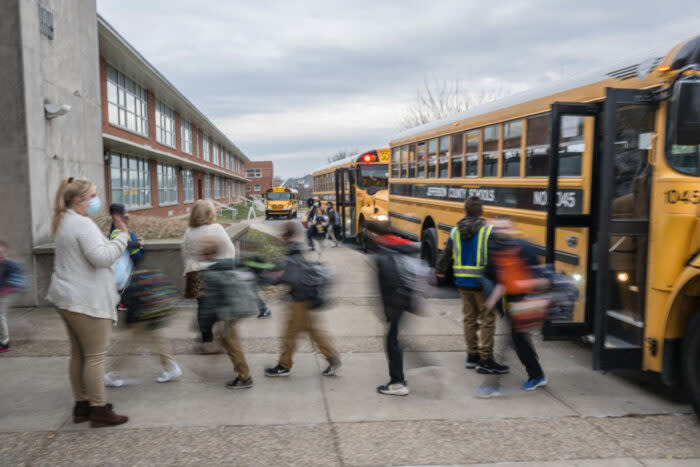 School busses arrive at school