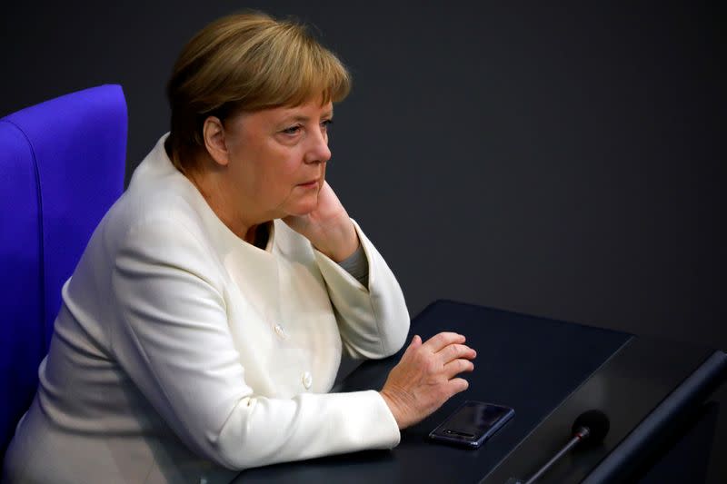 FILE PHOTO: German Chancellor Angela Merkel attends a session of the Bundestag, in Berlin