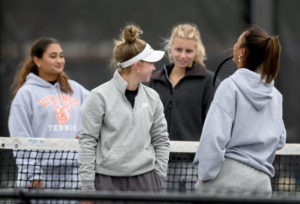 Hoover doubles players Nyla Spangler, Addie Sheil, Bridget Fink and Ema Papcke prepare to compete in Girls tennis Division I doubles sectional finals at Jackson Park Courts. Saturday, Oct. 7, 2023.