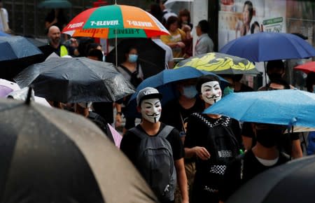 Anti-government demonstrators march in protest against the invocation of the emergency laws in Hong Kong
