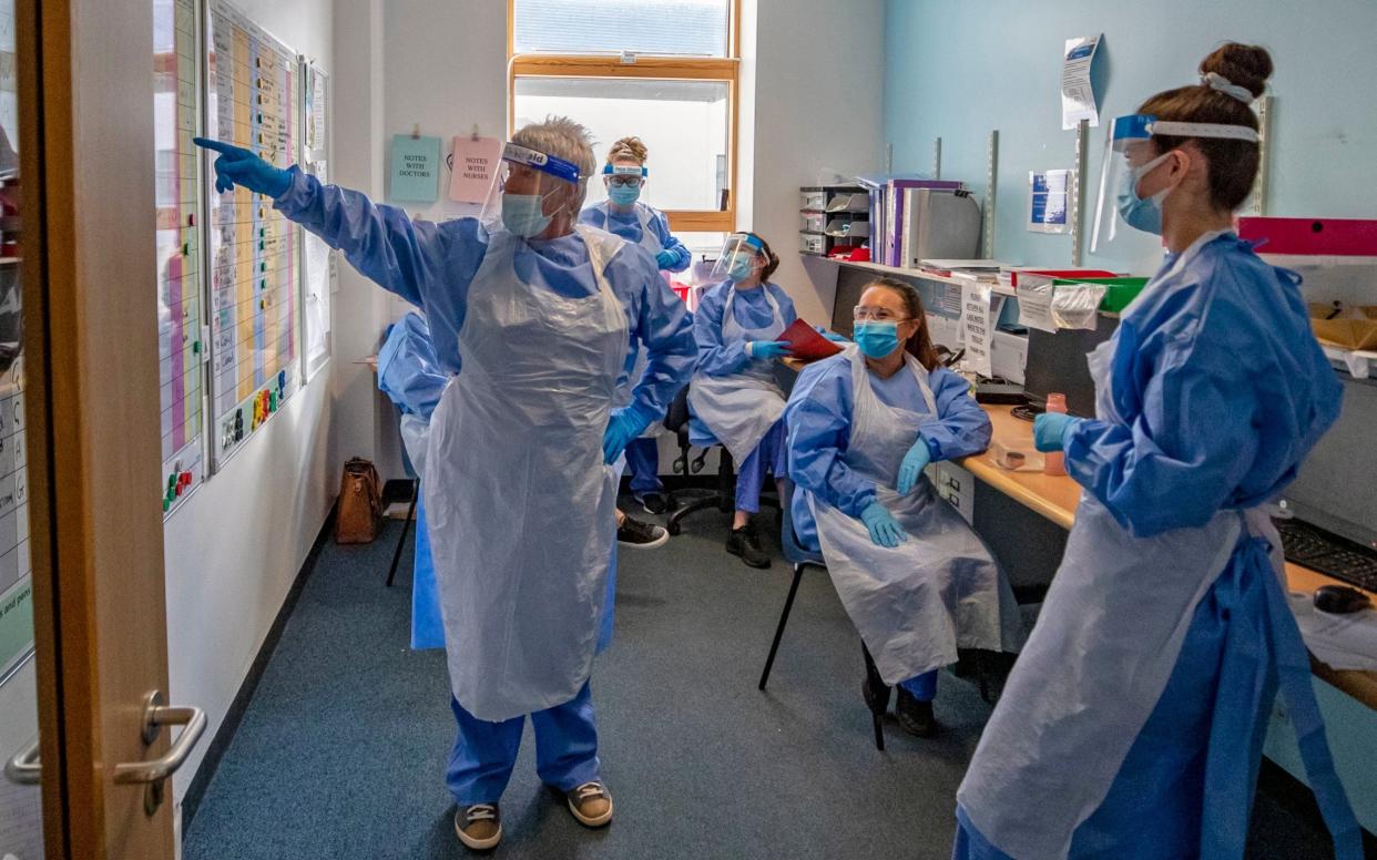 Nurses hold a meeting on one of five Covid-19 wards at Whiston Hospital in Merseyside where patients are taken to recover from the virus - Peter Byrne /PA
