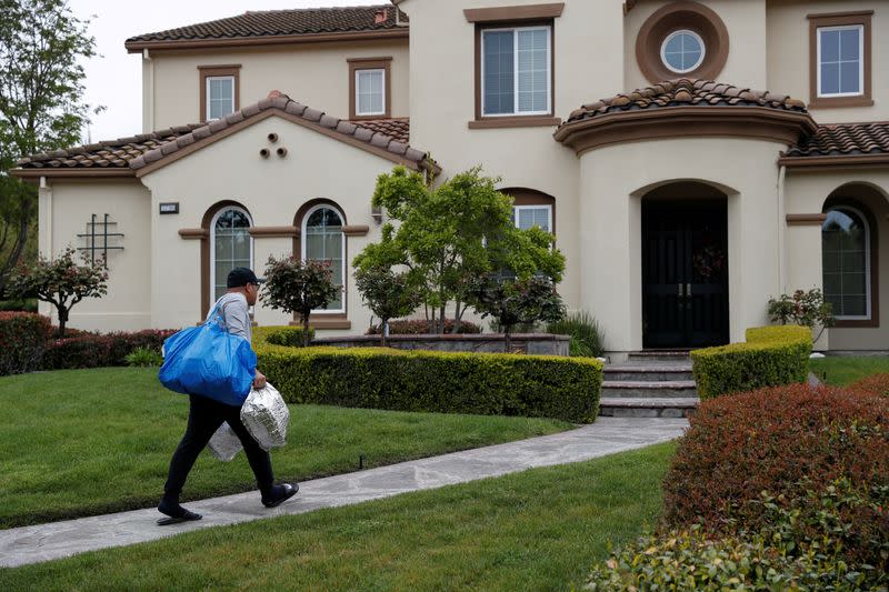 FILE PHOTO: A day in life of an Amazon courier during the coronavirus disease (COVID-19) outbreak