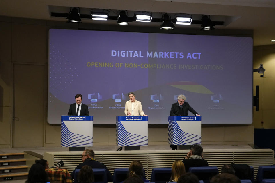 European Commissioner for Europe fit for the Digital Age Margrethe Vestager, center, and European Commissioner for Internal Market Thierry Breton, right, address a media conference regarding the Digital Markets Act at EU headquarters in Brussels, Monday, March 25, 2024. The European Commission on Monday opened non-compliance investigations against Alphabet, Apple and Meta under the Digital Markets Act. (AP Photo/Virginia Mayo)