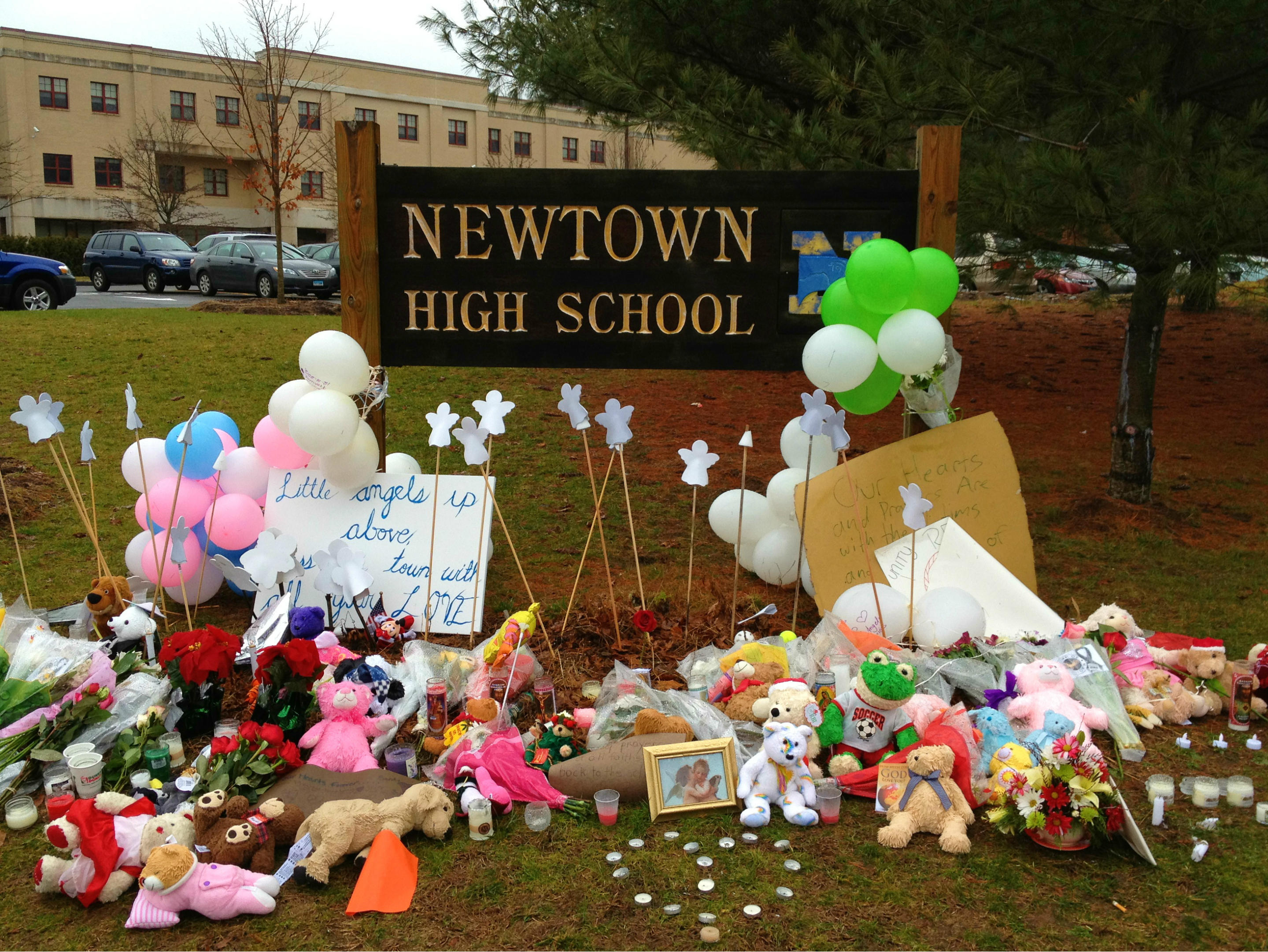 A makeshift memorial for the victims of the Sandy Hook Elementary school shooting is seen outside the entrance to Newtown High School, Dec. 15, 2012. About 60 surviving Sandy Hook students will graduate from the high school on Wednesday night. (Dylan Stableford/Yahoo News)