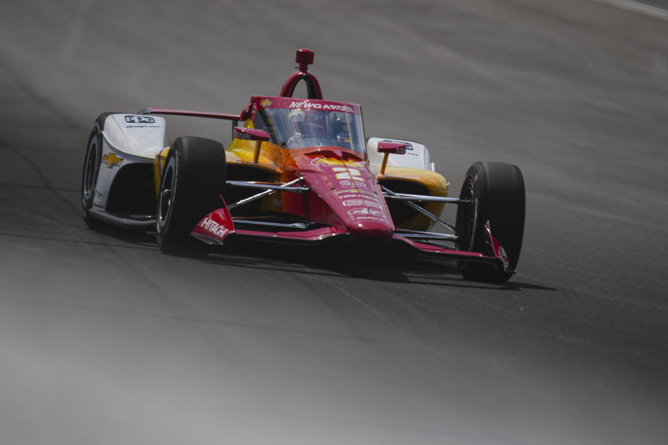 Josef Newgarden drives into Turn 2 during qualifying for the Indianapolis 500 auto race at Indianapolis Motor Speedway in Indianapolis, Sunday, May 19, 2024. (AP Photo/Michael Conroy)