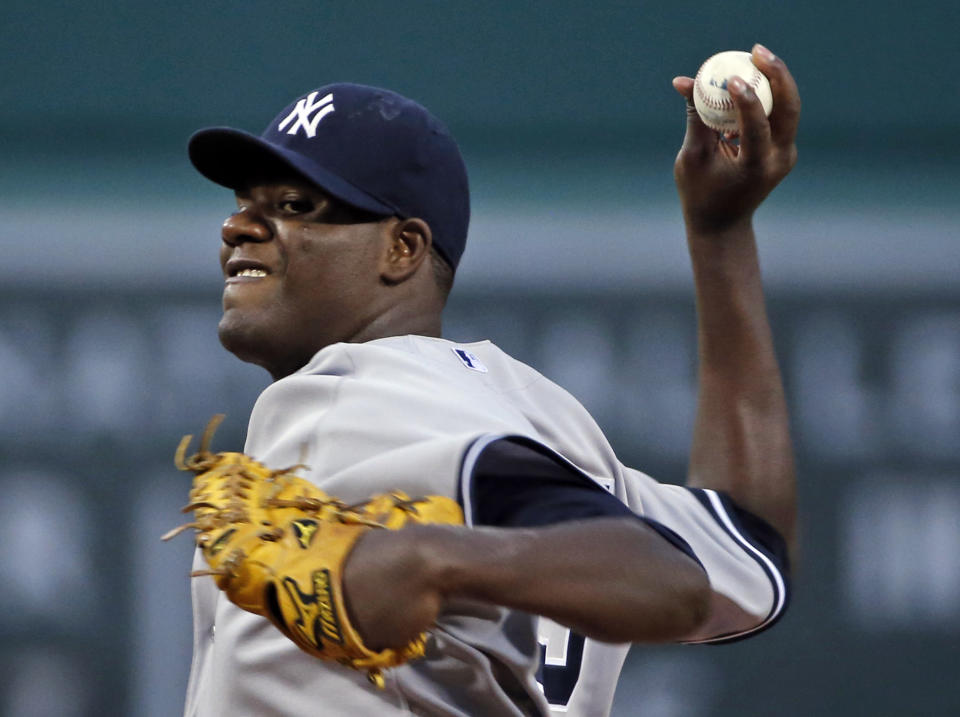 New York Yankees starting pitcher Michael Pineda delivers to the Boston Red Sox during the first inning of a baseball game at Fenway Park in Boston, Wednesday, April 23, 2014. (AP Photo/Elise Amendola)