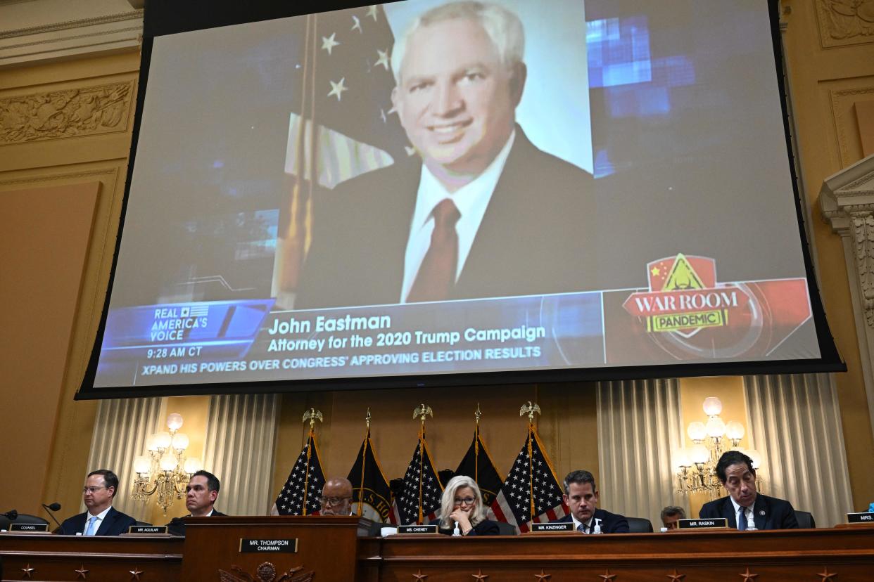 A picture of of John Eastman is projected above the House select committee.