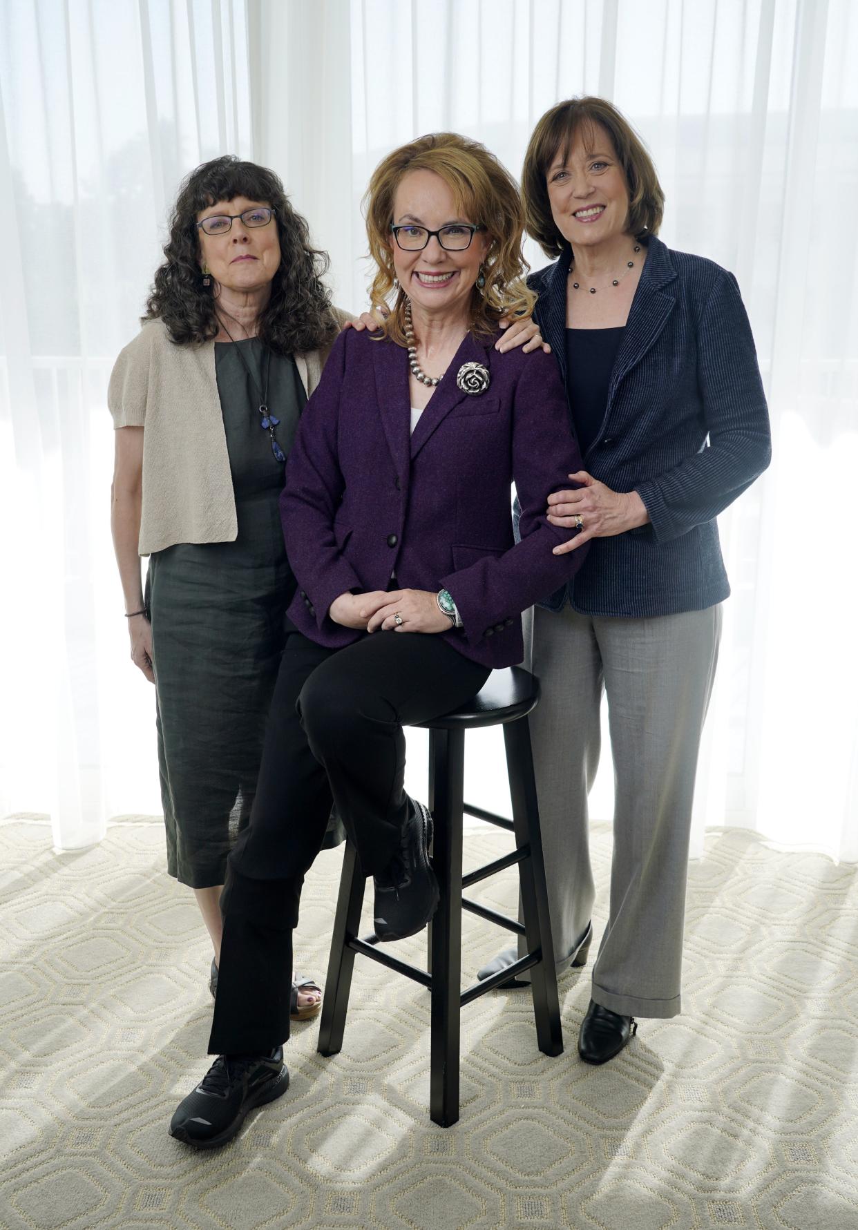 Gabby Giffords, center, the subject of the documentary film "Gabby Giffords Won't Back Down," poses with the film's co-directors Julie Cohen, left, and Betsy West, Tuesday, June 21, 2022, at the Beverly Hilton in Beverly Hills, Calif.