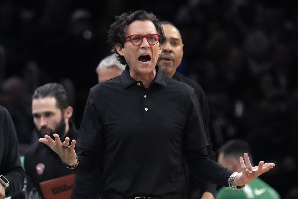 Atlanta Hawks coach Quin Snyder calls to officials during the first half of the team's NBA basketball game against the Boston Celtics, Wednesday, Feb. 7, 2024, in Boston. (AP Photo/Charles Krupa)