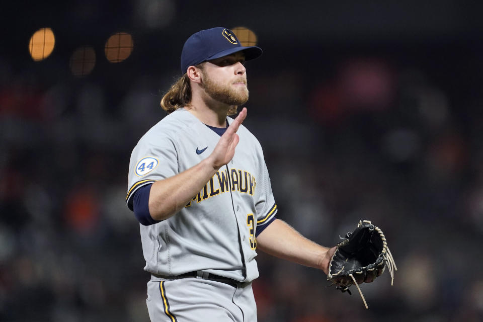 Milwaukee Brewers pitcher Corbin Burnes reacts after striking out San Francisco Giants' Buster Posey to end the sixth inning of a baseball game in San Francisco, Monday, Aug. 30, 2021. (AP Photo/Jeff Chiu)