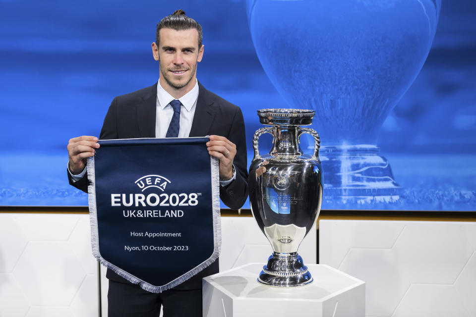 Gareth Bale, Welsh soccer player and Ambassador poses after UK and Ireland were elected to host the Euro 2028 fooball tournament during the the UEFA EURO 2028 and 2032 hosts announcement ceremony after the UEFA Executive Committee, at UEFA Headquarters, in Nyon, Switzerland, Tuesday, October 10, 2023. UEFA has decided the future of soccer’s European Championship for the next decade. The United Kingdom and Ireland will host in 2028 and an unusual Italy-Turkey co-hosting plan was picked for 2032. (Jean-Christophe Bott/Keystone via AP)