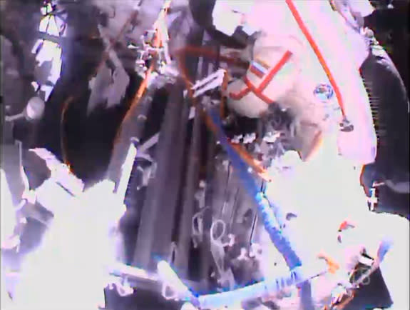 Two Russian spacewalkers exited the International Space Station on June 24, 2013 (EDT) for a spacewalk. One of them is seen at upper right. During the spacewalk, Flight Engineers Fyodor Yurchikhin and Alexander Misurkin will replace a fluid flo