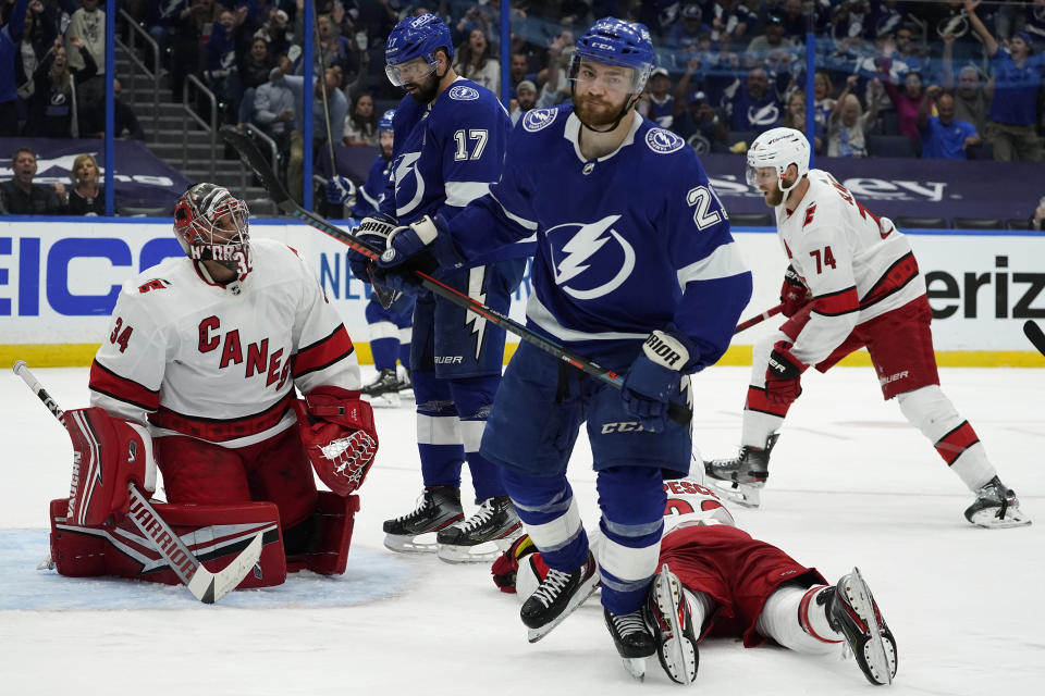 Tampa Bay Lightning center Brayden Point (21) reacts after scoring past Carolina Hurricanes goaltender Petr Mrazek (34) during the second period in Game 3 of an NHL hockey Stanley Cup second-round playoff series Thursday, June 3, 2021, in Tampa, Fla. (AP Photo/Chris O'Meara)