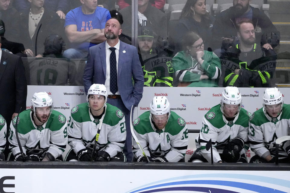 Dallas Stars coach Pete DeBoer looks up at the scoreboard after San Jose Sharks defenseman Erik Karlsson scored the go-ahead goal during the third period of an NHL hockey game Wednesday, Jan. 18, 2023, in San Jose, Calif. The Sharks won 5-3. (AP Photo/Tony Avelar)