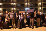 <p>U.S. Border Patrol trainees carry their luggage after their initial arrival to the U.S. Border Patrol Academy on August 2, 2017 in Artesia, N.M. (Photo: John Moore/Getty Images) </p>