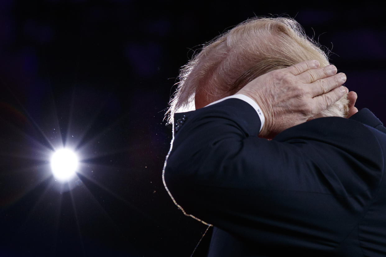 President Trump gestures as he makes a joke about his hair during remarks to the Conservative Political Action Conference, Feb. 23, 2018, in Oxon Hill, Md. (Photo: Evan Vucci/AP)