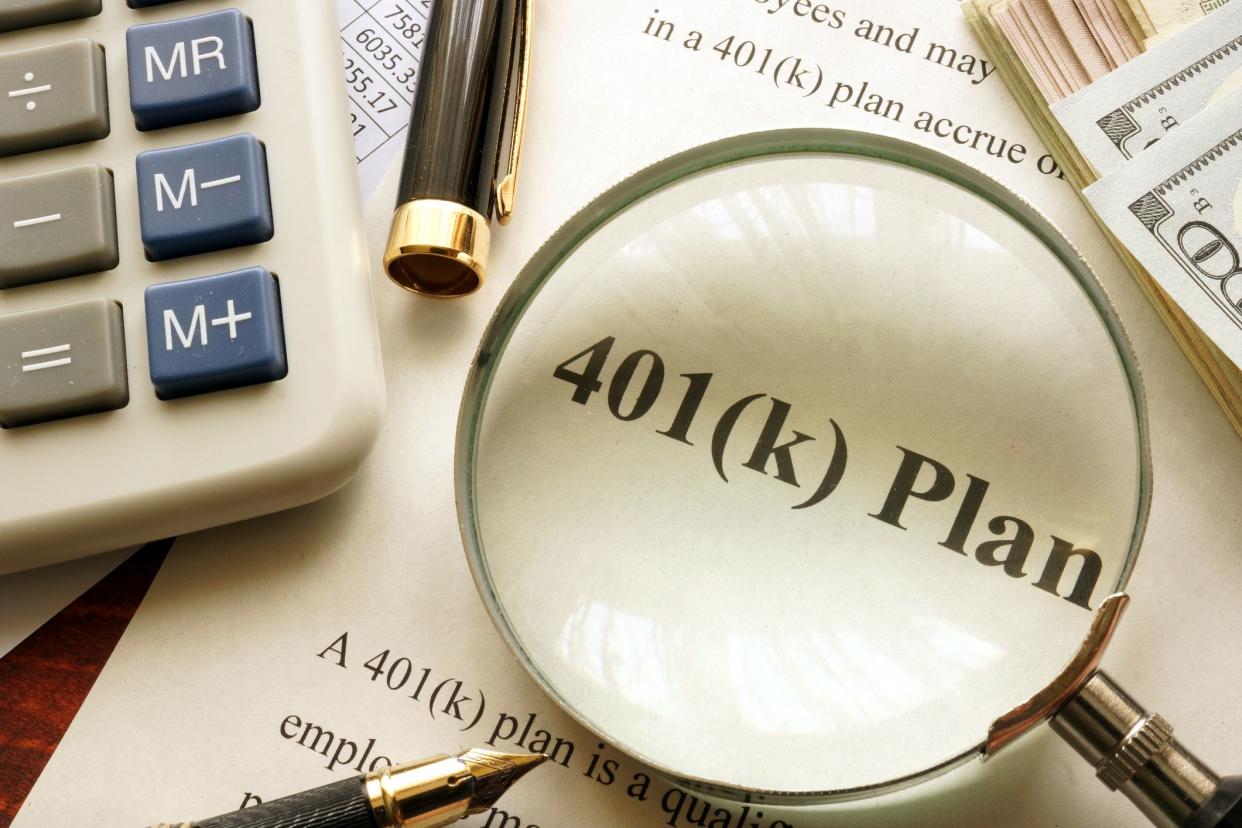 Document with title 401k plan on a table.