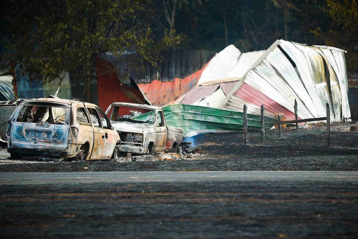 Burnt vehicles and destroyed buildings remained after a gas pipeline explosion just outside of Junction City on Aug. 1, 2019.