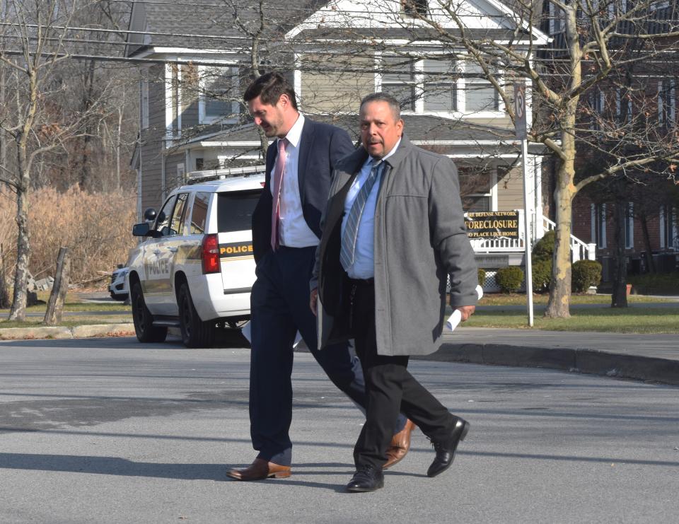 Wallkill Town Supervisor George Serrano, right, leaves the Orange County Courthouse with his attorney Friday, Dec. 8.