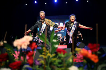 Holocaust survivors take part in the annual Holocaust survivors' beauty pageant in Haifa, Israel October 14, 2018. REUTERS/Corinna Kern