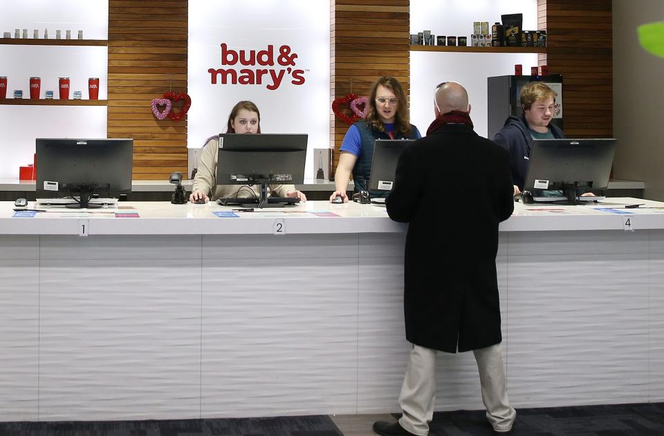 Employees of Bud & Mary's Cannabis Dispensary sell cannabis products at the counter of the store Wednesday, Feb. 15, 2023, in Windsor Heights, Iowa.
